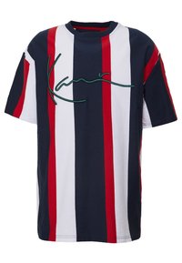 Pruhované tričko v námořnické, bílé a červené barvě, s kulatým výstřihem a zeleným vyšívaným logem na přední straně. Vyrobeno z měkké bavlněné látky.