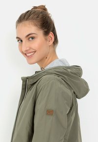 camel active Short coat - sage