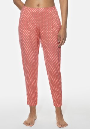 Pantalons à motif rouge avec des pois blancs, dotés d'une coupe décontractée, d'une taille élastique et de jambes fuselées. Tissu doux avec une texture lisse.
