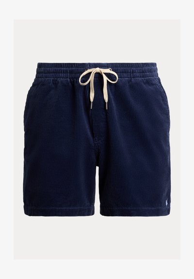 Σόρτς από κοτλέ ύφασμα σε ναυτικό μπλε με ελαστική μέση που δένει, διακοσμημένα με εκρού λεπτομέρειες, πλαϊνές τσέπες και μικρό λογότυπο στο κάτω τελείωμα.