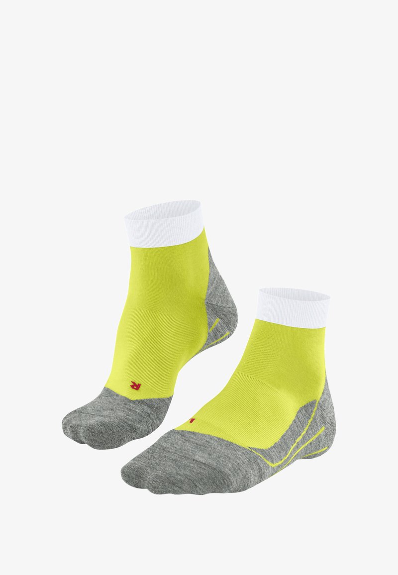 Jasnożółte i szare skarpetki do kostek z białym mankietem, z czerwonym logo po boku oraz teksturowaną wkładką dla komfortu.