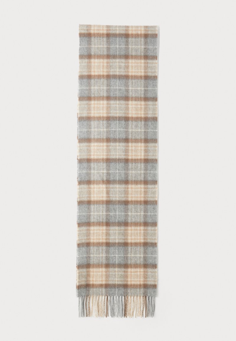 Écharpe à carreaux grise et beige avec des bords frangés, fabriquée à partir d'un tissu doux, présentant un motif à carreaux dans des couleurs et textures alternées.