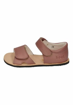 Pink leather sandal with two adjustable hook-and-loop straps, open toe design, tan insole, and black rubber outsole. Features brand logo.