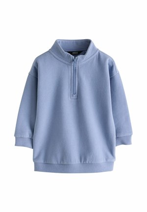Lyseblå langærmet pullover med halv lynlås, ribkanter og høj krave, designet til casual brug.