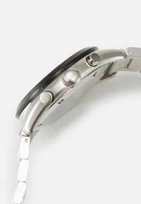 Seleccionado, silver-coloured