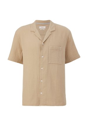 Chemise beige à manches courtes en coton texturé avec un col, dotée d'une poche poitrine et de cinq boutons blancs sur le devant.
