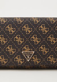 Brown patterned wallet with gold logo, features textured surface, and diamond motif with interlocking initials. Triangular hardware accent.