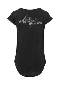 Black t-shirt featuring a graphic of mountains and trees in white on the back. Soft texture, rounded hem, and relaxed fit.