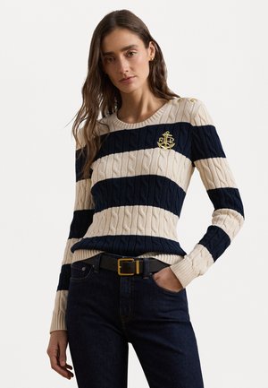 Navy and cream striped cable-knit sweater with a round neckline, featuring a gold anchor logo and button accents on the shoulder.