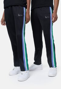 Karl Kani SMALL SIGNATURE STRAIGHT LEG TRACKPANTS UNISEX - Donji dijelovi trenirke - black