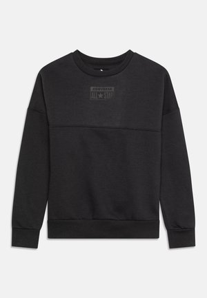 Schwarzer Pullover aus Baumwollmischung mit langen Ärmeln, gerippten Bündchen und Saum sowie einem strukturierten Logopatch auf der Vorderseite.