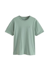 Heleroheline puuvillane T-särk ümmarguse kaelusega, lühikeste varrukatega ja väikese logoga vasakul rinnal. Pehme tekstuur ja lõdvestunud lõige.