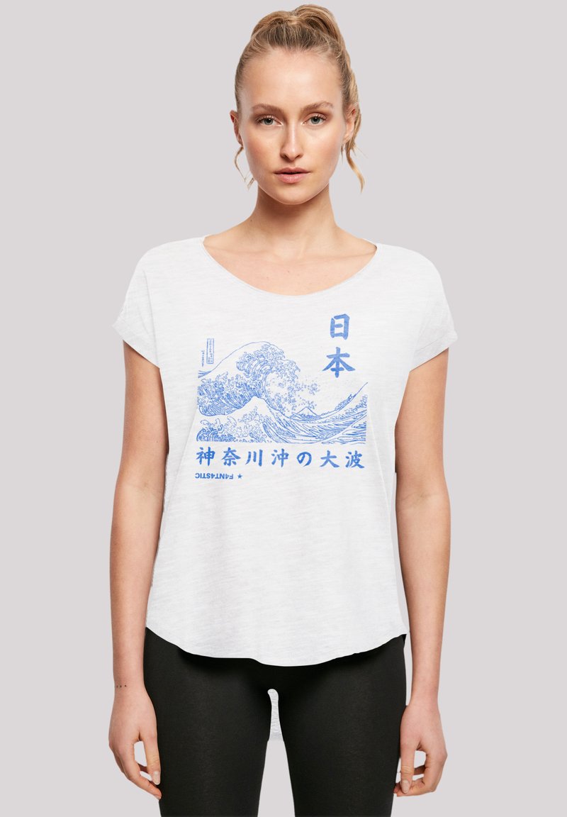 White short-sleeve t-shirt featuring blue graphic print of waves and Japanese text. Round neckline and relaxed fit. Soft texture.