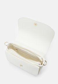 White faux leather clutch with gold-toned hardware, a zippered compartment, and two inner sections for organization.