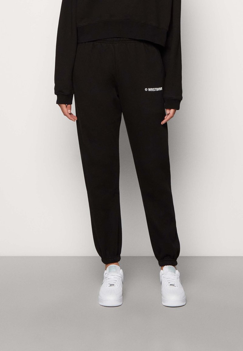 WRSTBHVR STUDIO WOMEN Tracksuit bottoms black Zalando.ie
