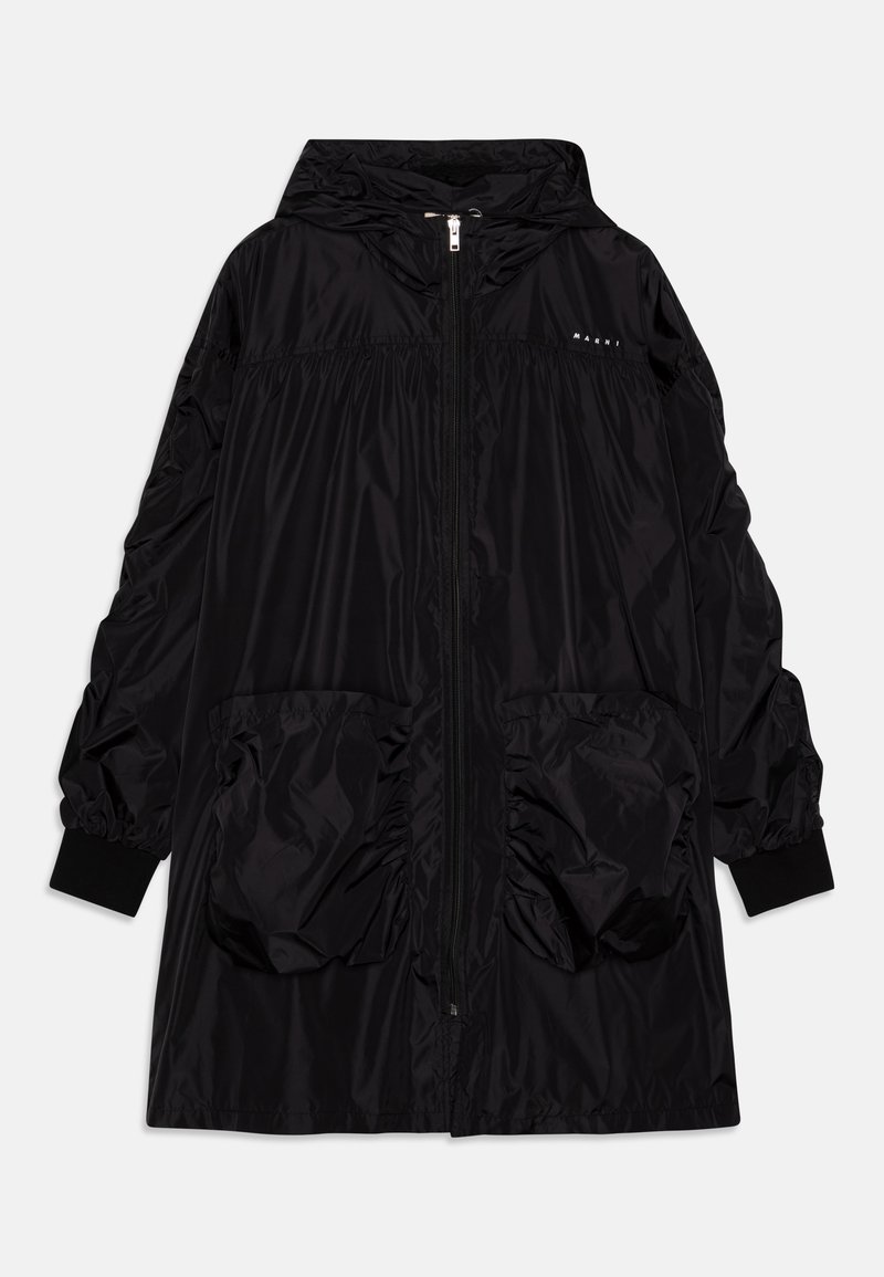 Black nylon hooded jacket with a zipper front, elasticized waist panel, oversized pockets, and elastic cuffs. Features a sleek, smooth texture.