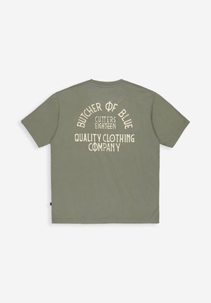 Olive green short-sleeve t-shirt with cream text "Butcher of Blue Cutters Eighteen Quality Clothing Company" on the back.