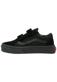Black sneakers with a suede and canvas upper, featuring two Velcro straps and a grey leather side stripe. Thick rubber sole in black.