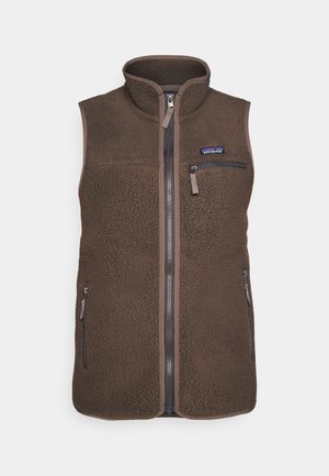 Fleece vest i mørkebrun med høy krage, glidelås foran og lomme på brystet. Teksturert stoff med kontrastkant og glidelåslommer på siden.