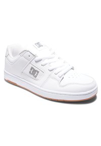 White sneaker with smooth leather upper, perforated toe for breathability, lace-up design, rubber sole, and logo accent on the side.
