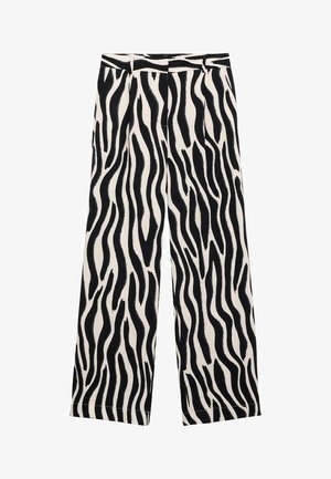 Spodnie o szerokich nogawkach w wyrazisty wzór czarno-biały w paski zebry, wykonane z lekkiego materiału o gładkiej fakturze.