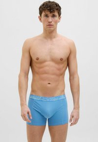 Light blue boxer shorts made of soft fabric with a Jacks & Jones logo waistband. Features a snug fit and smooth texture.