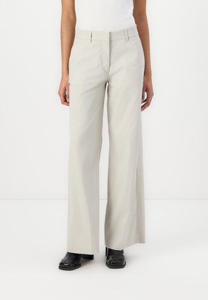 TYA TECH - Trousers - beige