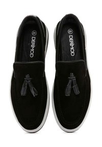 Black suede slip-on shoes with a white rubber sole, decorative tassels, and stitched detailing. Brand label visible inside.