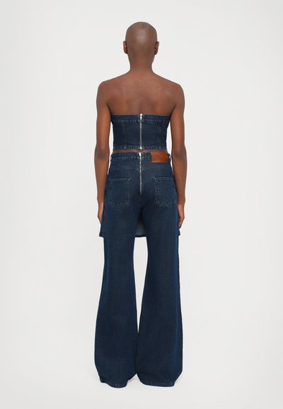 Denim tube top and wide-leg jeans, dark wash, featuring a zipper closure, contrasting denim panel at back, and leather brand patch.