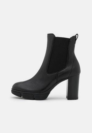 Højhælede støvletter - black