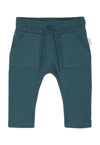Pantalons de survêtement en coton teal avec une taille élastique, un détail de cordon de serrage et deux poches avant. Ce design présente une texture lisse et des jambes ajustées.