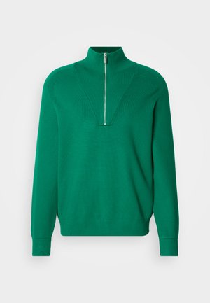 Zelený svetr na zip s vysokým límcem a V-šikmým žebrovaným vzorem vpředu. Měkká textura, dlouhé rukávy a přiléhavé manžety.