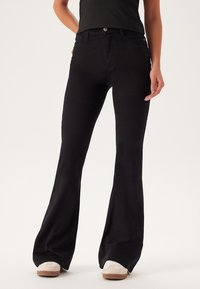 HIGH - Jeans a zampa - black
