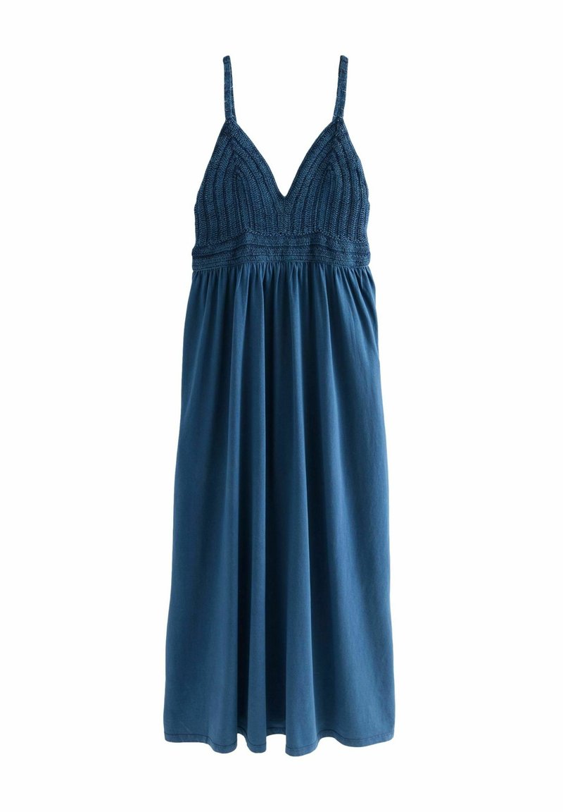 Robe bleue sans manches avec corsage tricoté, encolure en V plongeante, fines bretelles et jupe fluide.
