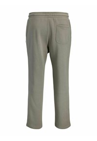 Vaaleanvihreät collegehousut pehmeästä kankaasta, joissa on joustava vyötärönauha ja takatasku. Suora lahjemalli, jossa on minimaalinen saumaus.