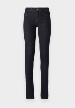 Mørkeblå denimjeans med smal passform, med høy midje, fem lommer og oransje sømdetaljer langs sømmene.