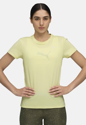 Vaaleankeltainen, lyhythihainen urheilupaita, jossa on hillitty valkoinen Puma-logo. Valmistettu hengittävästä kankaasta, muotoon ommeltu design ja sileä pinta.