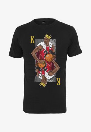 Black t-shirt featuring a graphic of a basketball player in a red jersey with the number 23, wearing a crown and fur accents.