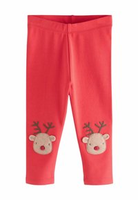 Czerwone legginsy dziecięce z haftowanymi twarzami reniferów i rogami na kolanach.