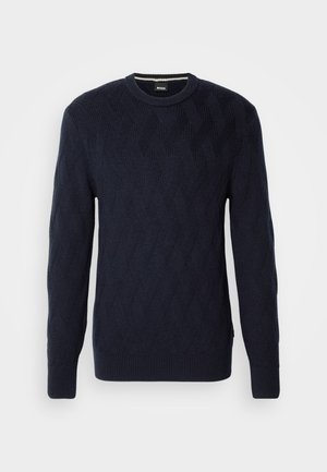 Maglione lavorato a maglia di colore blu navy caratterizzato da un motivo a diamante testurizzato, con polsini e scollatura a coste. Design classico con scollo rotondo e silhouette aderente.