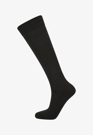 Chaussette noire haute jusqu'au genou avec texture côtelée isolée sur fond blanc.
