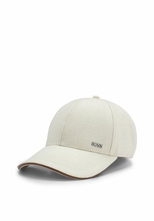 Light beige fabric baseball cap with curved brim and small metallic "BOSS" logo on the front panel.