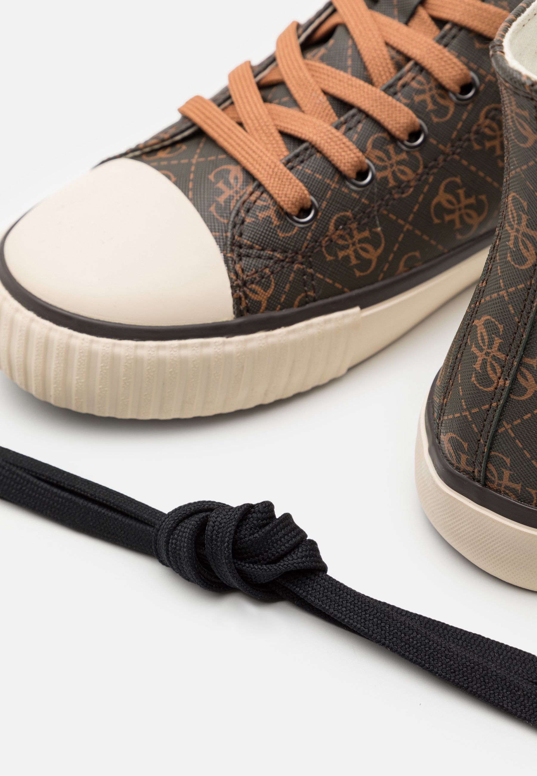 black and gold guess trainers