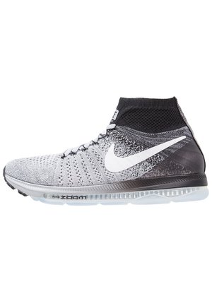 Light grey and black knitted high-top Nike running shoe with white swoosh logo and visible air cushion sole.