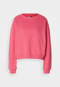 Pink cropped sweatshirt with long sleeves, ribbed cuffs, and a round neck. Features a small embroidered logo on the chest. Soft texture.