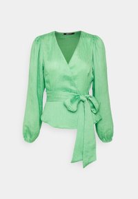 Blusa avvolgente verde chiaro con maniche lunghe, scollatura a V, vita cincherata e dettaglio annodato. Realizzata in tessuto testurizzato con una finitura liscia.