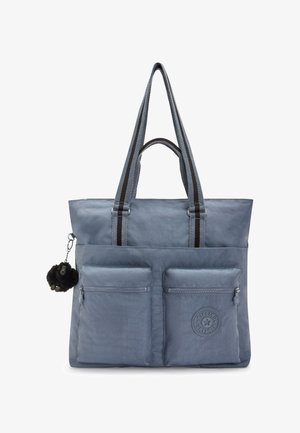 Sac fourre-tout bleu avec deux poches zippées à l'avant, poignées à rayures noires et un petit porte-clés en peluche noire en forme de singe attaché sur le côté.