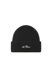 Black knitted beanie with a folded cuff and white embroidered "Les Deux" branding on the front. Smooth texture, rounded top shape.