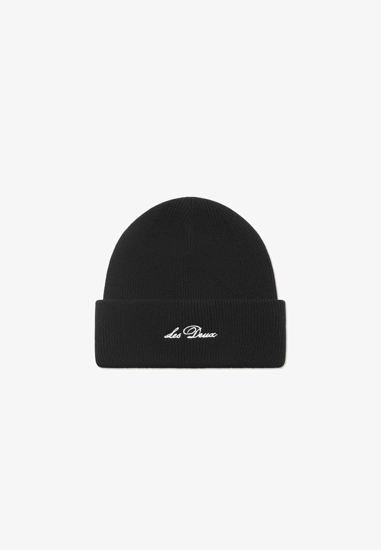 Black knitted beanie with a folded cuff and white embroidered "Les Deux" branding on the front. Smooth texture, rounded top shape.