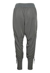 Grå, lätta joggingbyxor med texturerad yta, elastisk midja, avsmalnande ben och dragsko-detaljer vid mudden.